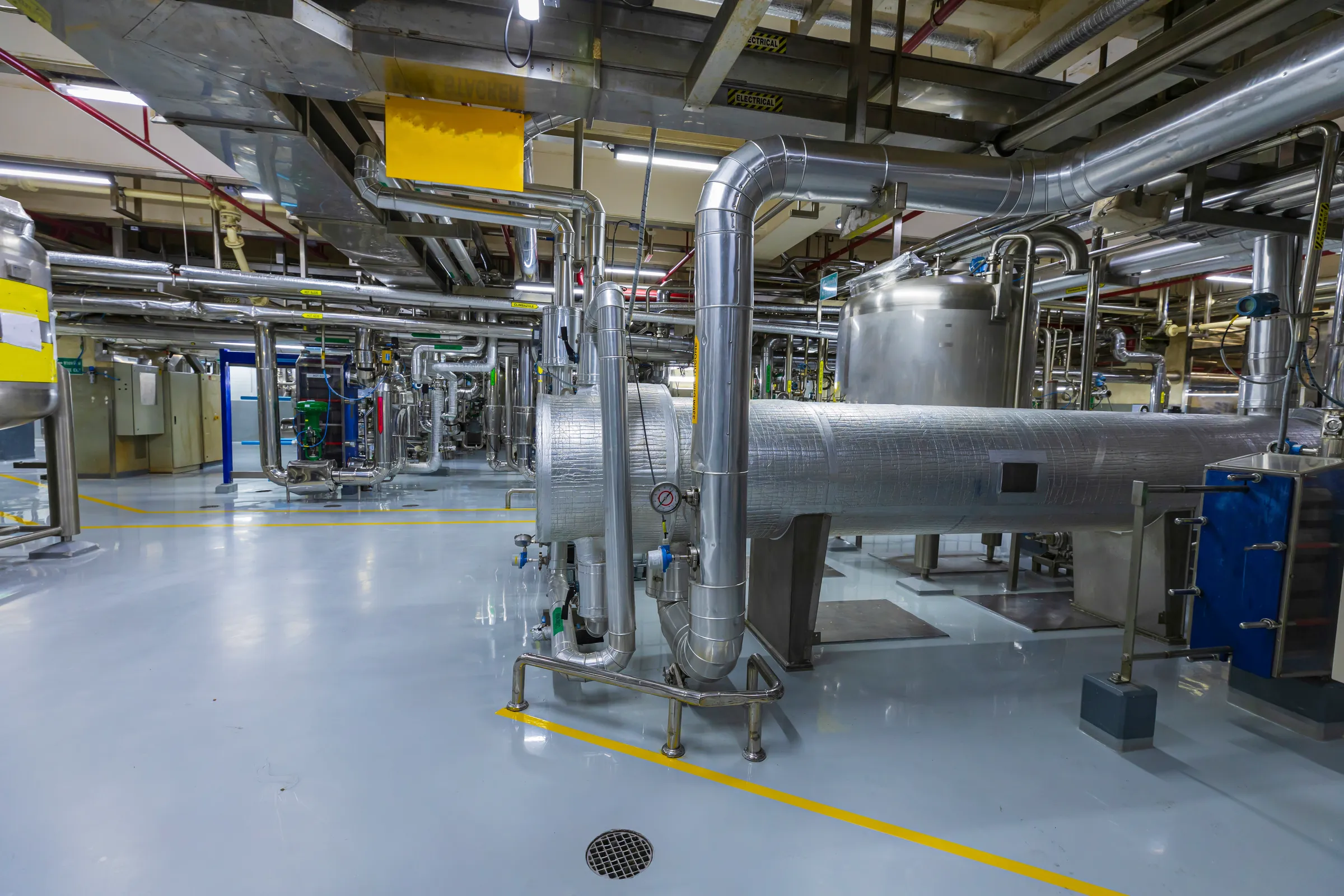 Commercial plant room with insulated pipework and heat exchangers